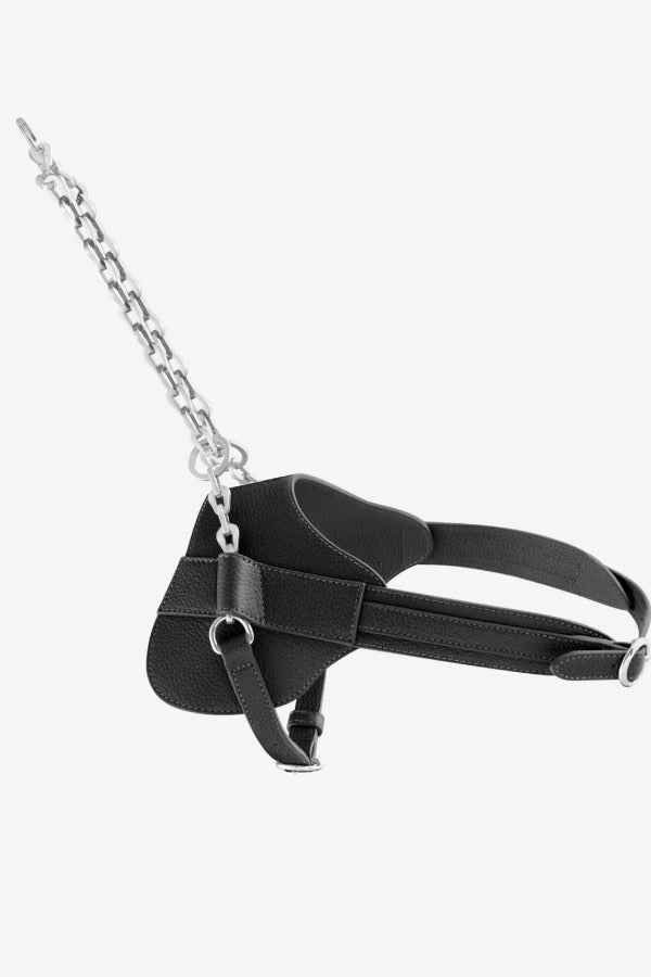 Side view of steel and leather simone harness on white background, with no model shown.