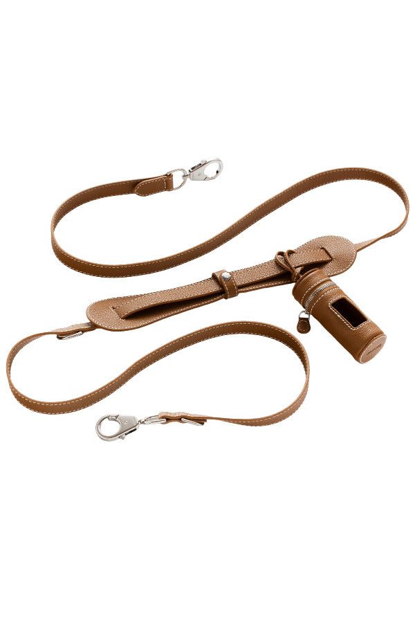 Side view of saddle tascher leash on white background, with no model shown.