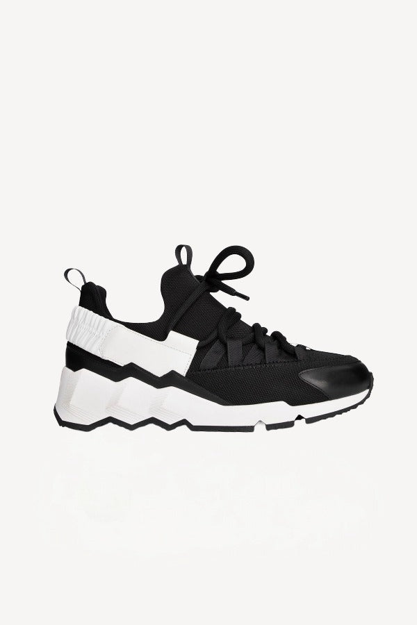 Right side view of black/white alf and canvas trek comet sneaker on white background, with no model shown.