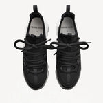 Overhead view of black/white calf/canvas trek comet sneakers on white background, with no model shown.