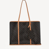 Front view of black/tan canvas cube and calf cab tote on white background, with no model shown.