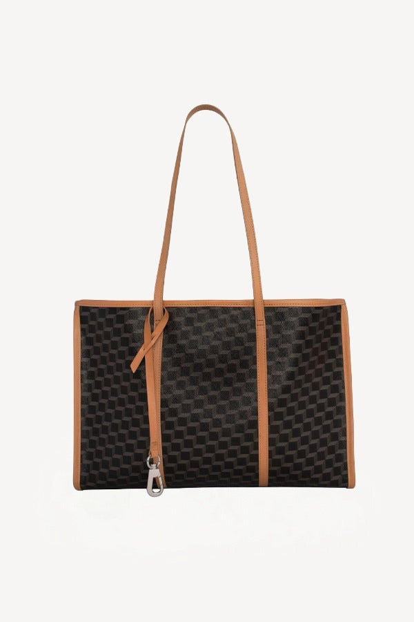 Back view of black/tan canvas cube and calf cab tote on white background with no model shown.