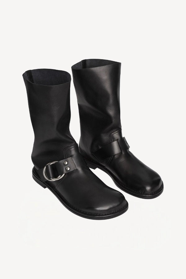 Front slanted view of black kristen ankle boot on white background, with no model shown.