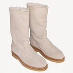 Front slanted view of off-white montana suede and sherling ankle boot on white background, with no model shown.