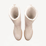 Overhead view of off-white montana suede and sherling ankle boot on white background, with no model shown.