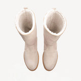 Overhead view of off-white montana suede and sherling ankle boot on white background, with no model shown.