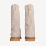 Back view of off-white montana suede and sherling ankle boot on white background, with no model shown.