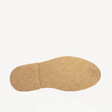 Sole view of off-white montana suede and sherling ankle boot on white background, with no model shown.