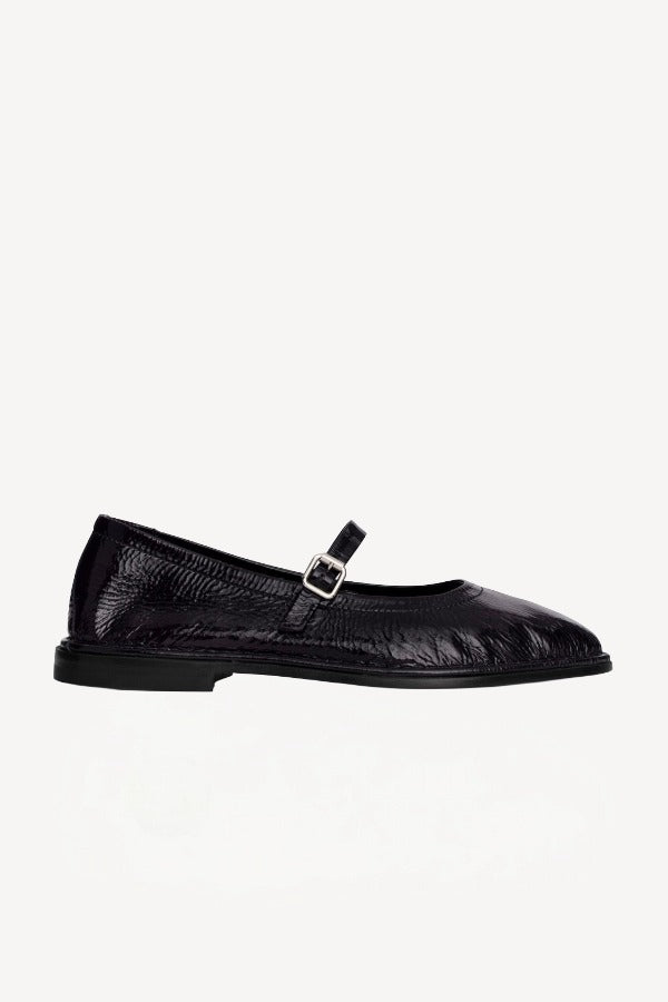 Right side view of plum patent trish ballet flat on white background with no model shown.