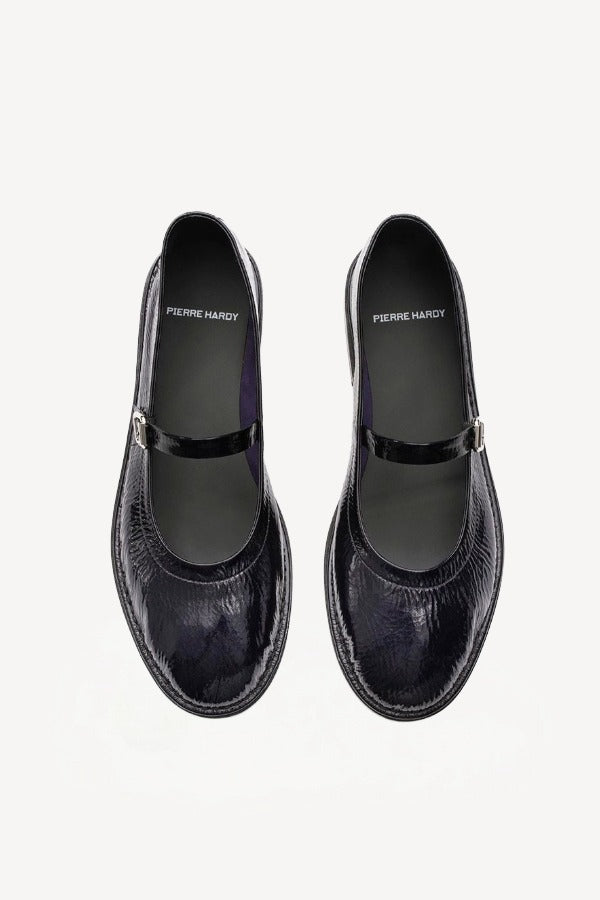 Overhead view of plum patent trish ballet flat on white background, with no model shown.
