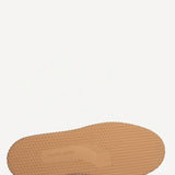 Sole view of camel start sneakers on white background, with no model shown.