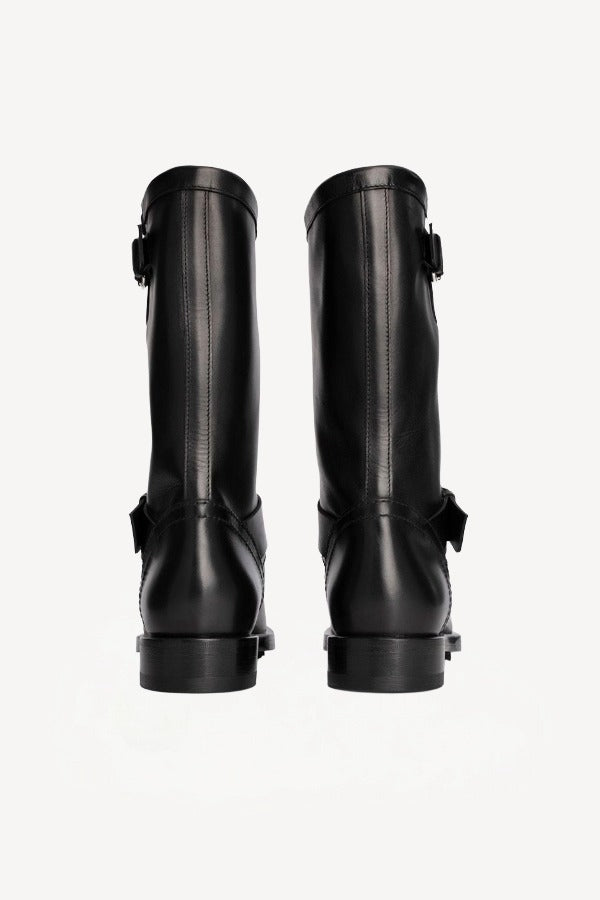 Back view of black wild calf ankle boot on white background with no model shown.