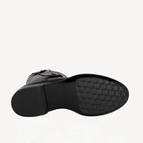 Sole view of black wild calf ankle boot on white background, with no model shown.