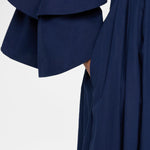 Side closeup view of navy fiesta shirt dress on model, against a white background.