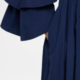 Side closeup view of navy fiesta shirt dress on model, against a white background.