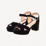 Pair view of black crushed velvet deidre platform sandals on white background, with no model shown.