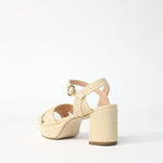 Back view of natural raffia deidre platform on white background, with no model shown.