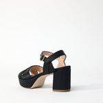 Back view of black raffia deidre platform on white background, with no model shown.