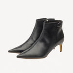 Pair view of black flame ankle boot on white background, with no model shown.