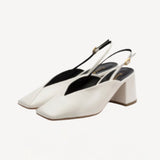 Pair view off white marquito block heel on white background, with no model shown.