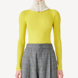 Front closeup view of grigio fantasia bogart wool/silk trousers on model wearing yellow sweater, against a white background.
