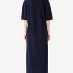 Back view of cielo cashmere long t-shirt dress on model wearing red heels, against a white background.