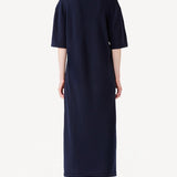 Back view of cielo cashmere long t-shirt dress on model wearing red heels, against a white background.