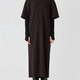 Alternate front view of brown cashmere long t-shirt dress on model wearing boots, against a white background.