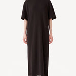 Front view of brown cashmere long t-shirt dress on model wearing black boots, against a white background.