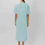 Back view of cielo cashmere long t-shirt dress on model wearing sandals, against a white background.