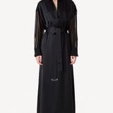 Front view of black francesca dress on model wearing black heels, against a white background.