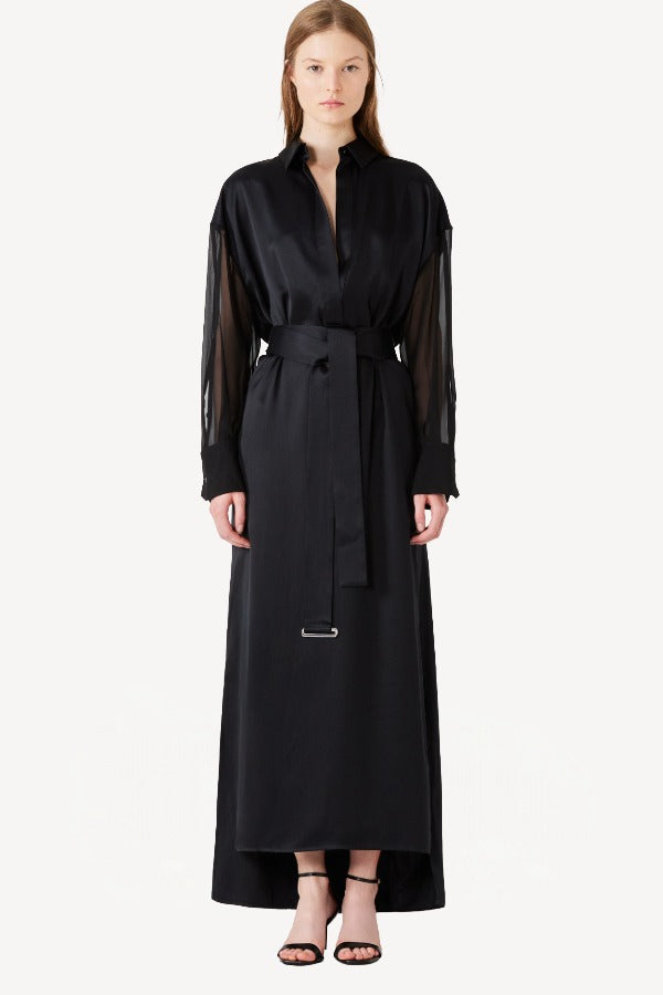 Front view of black francesca dress on model wearing black heels, against a white background.