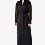 Alternate front view of black francesca dress on model wearing heels, against a white background.
