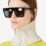 Front view of ivory knit cashmere collar scarf on model wearing a yellow sweater, against a white background.