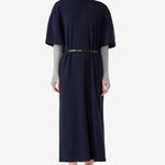 Front view of navy knit cashmere collar scarf on model wearing navy dress, against a white background.
