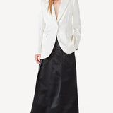Alternate front view of ivory double satin andrea blazer on model wearing black skirt, against a white background.