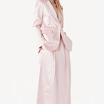 Alternate front view of pink duchesse andrea blazer on model wearing pink skirt, against a white background.