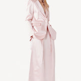 Alternate front view of pink duchesse andrea blazer on model wearing pink skirt, against a white background.