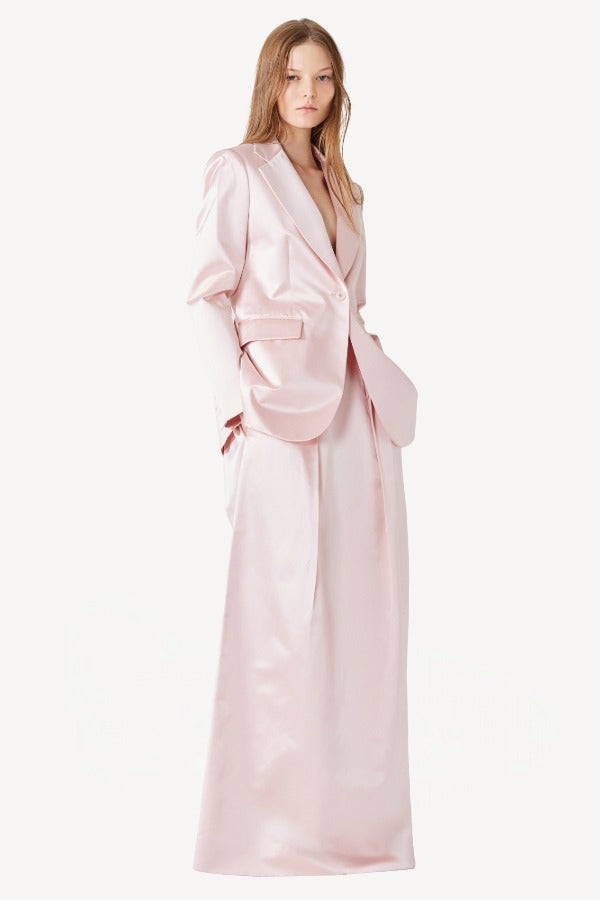 Alternate front view of pink duchesse andrea blazer on model wearing pink skirt, against a white background.