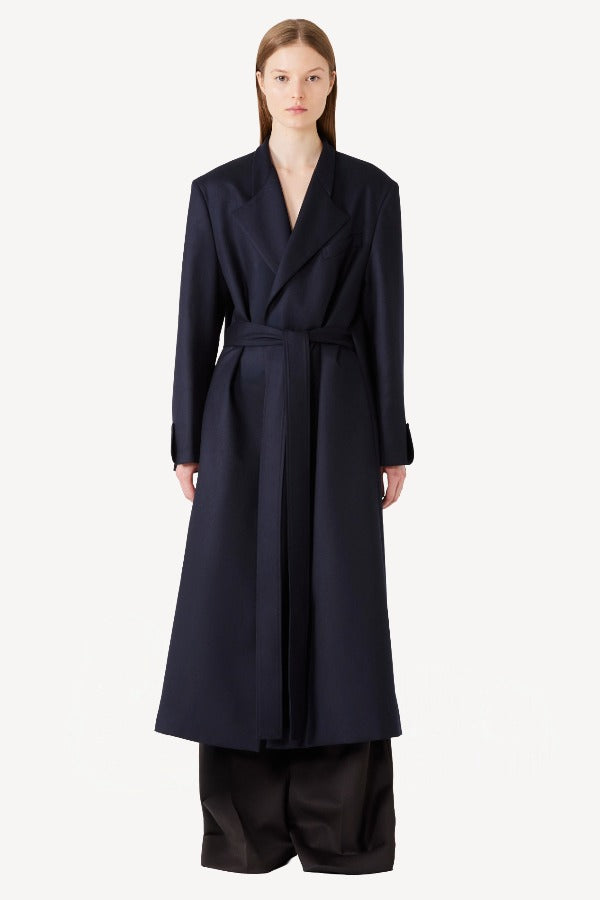 Front view of navy l/s wool lauren trench coat on model wearing black pants, against a white background.