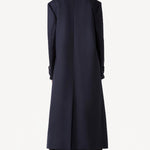 Back view of navy l/s wool lauren trench coat on model wearing black pants, against a white background.