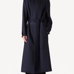 Alternate front view of navy l/s wool lauren trench coat on model wearing black pants, against a white background.
