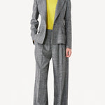Front view of grigio fantasia wool petit blazer on model wearing grigio pants, against a white background.