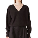 Front view of brown lavinia sweater on model wearing brown pants, against a white background