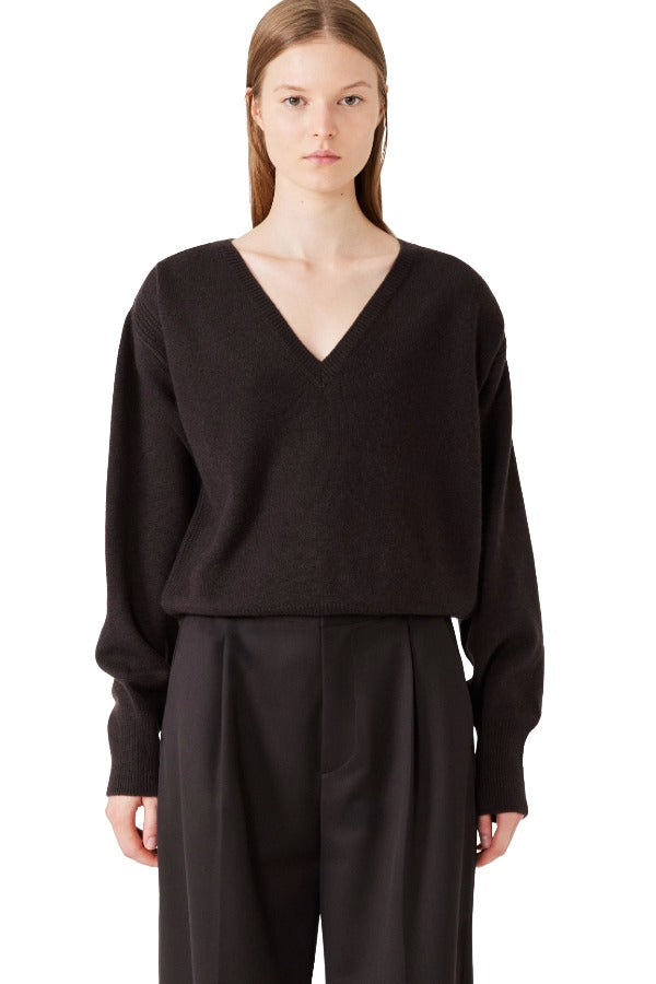 Front view of brown lavinia sweater on model wearing brown pants, against a white background