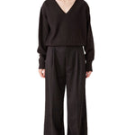 Front view of brown lavinia sweater on model wearing brown pants, against a white background.