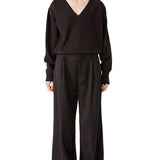 Front view of brown lavinia sweater on model wearing brown pants, against a white background.