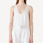 Front view of ivory S/L Silk/Viscose Tank top on model wearing white pants, against a white background.
