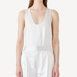 Front view of ivory S/L Silk/Viscose Tank top on model wearing white pants, against a white background.