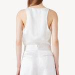 Back view of ivory S/L Silk/Viscose Tank Top on model wearing white pants, against a white background.